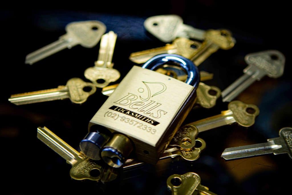 Bells Locksmiths Padlock With Keys On Table